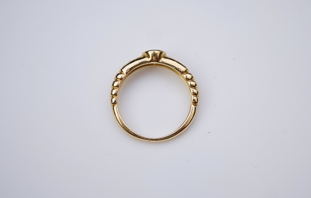 A yellow diamond and diamond ring